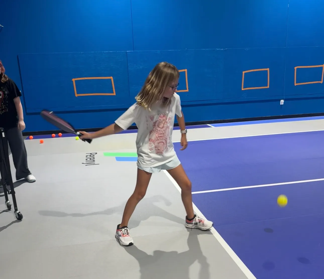 Kid Hitting Pickleball